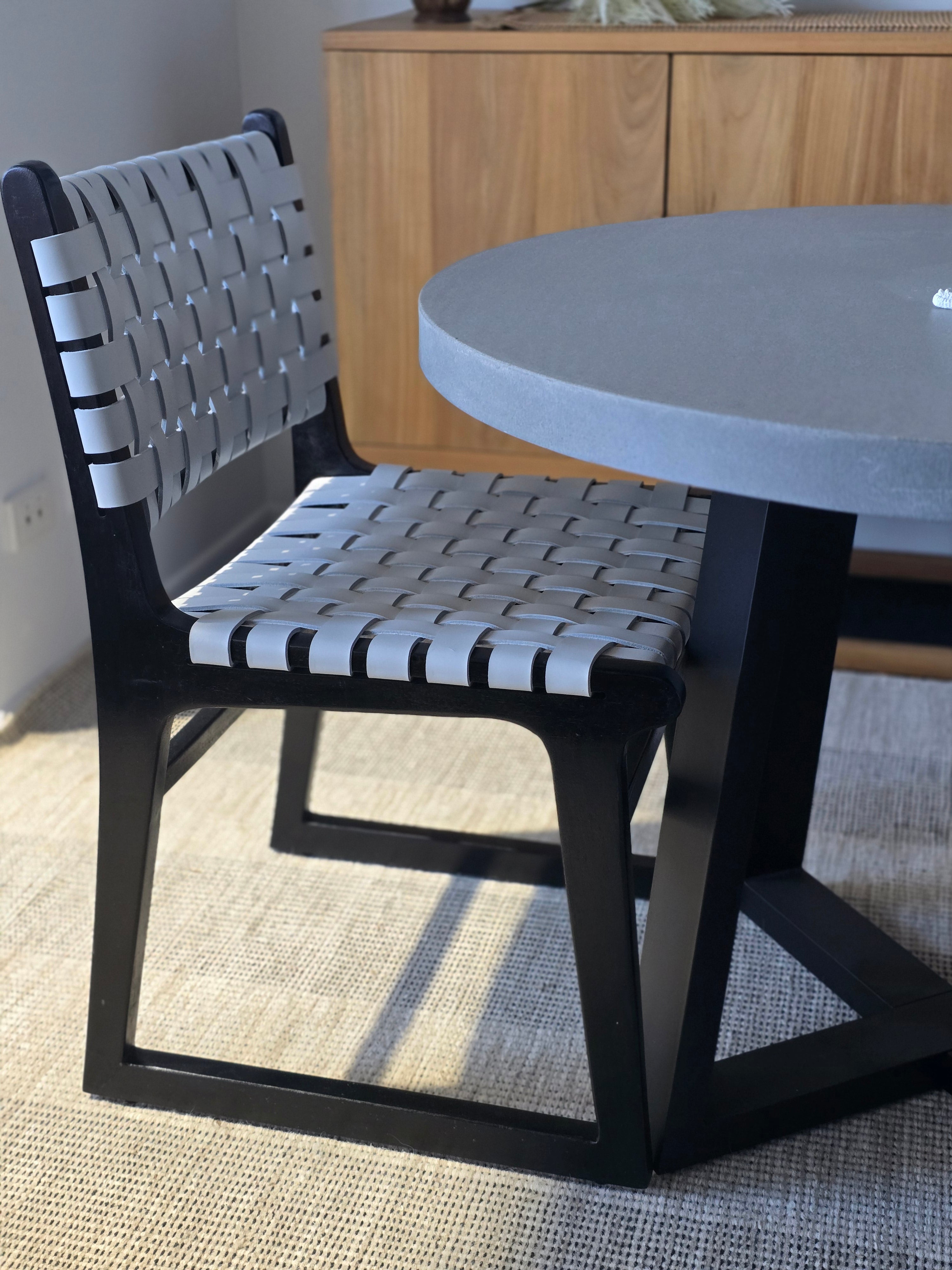 1.0 Alta Round Pebble grey Dining table|Black powder coated legs with 2 grey woven leather chairs